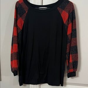 Chic Black Top with Red Plaid Sleeves